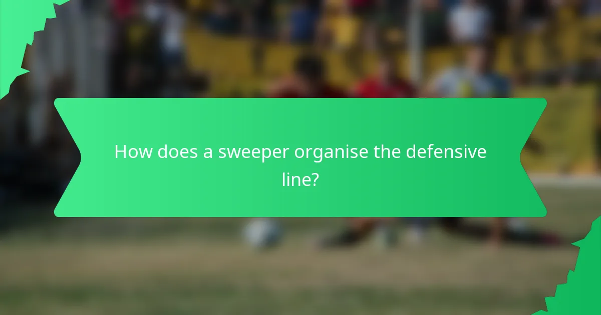 How does a sweeper organise the defensive line?