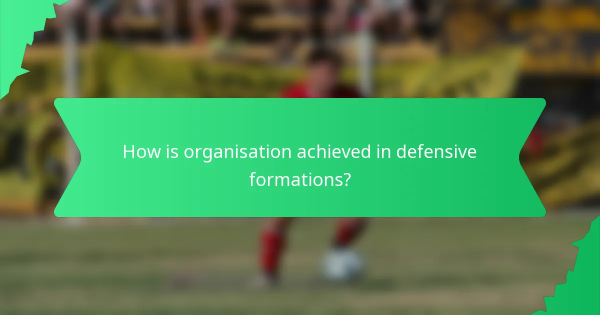 How is organisation achieved in defensive formations?
